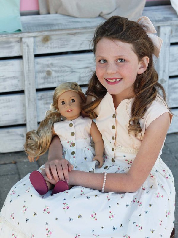 happy girl and her dolly in matching Opal dresses